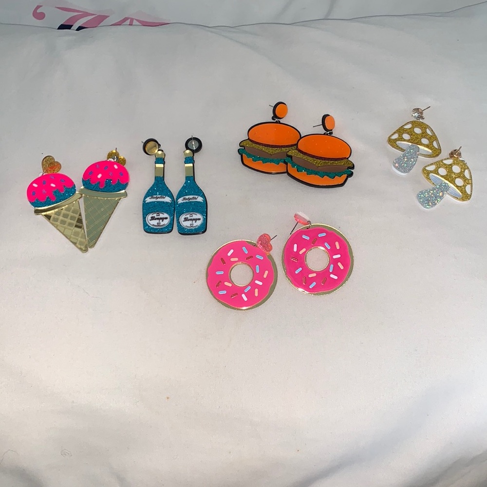 Colorful earrings of various things.